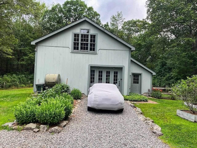 rear view of house with a yard