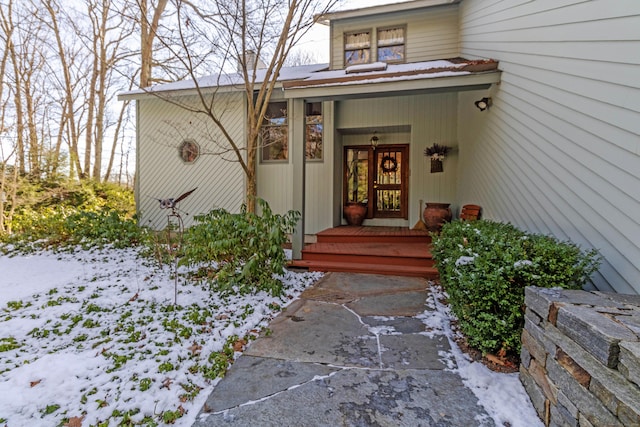 view of snow covered property entrance