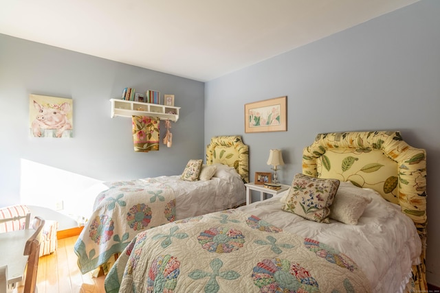 bedroom with hardwood / wood-style floors