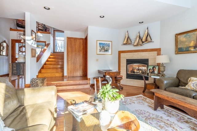 living room with a fireplace and light hardwood / wood-style floors