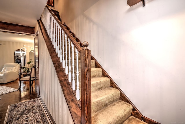 staircase featuring hardwood / wood-style floors