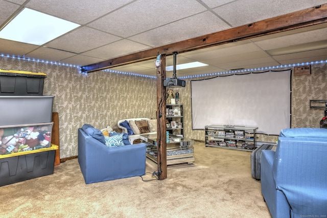 interior space with a drop ceiling and carpet floors