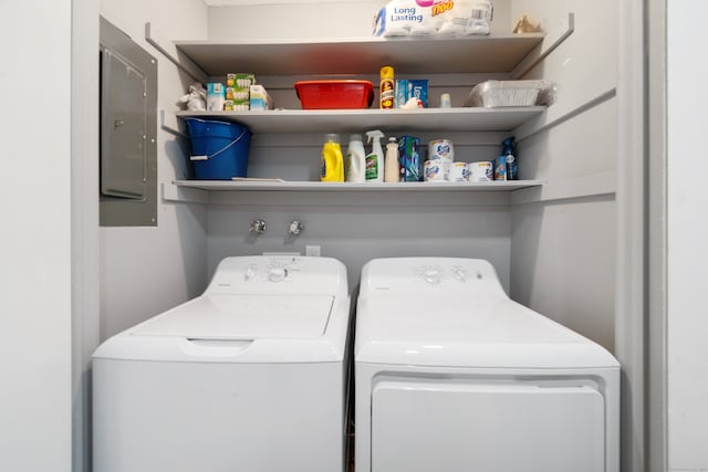 washroom featuring washer and dryer and electric panel