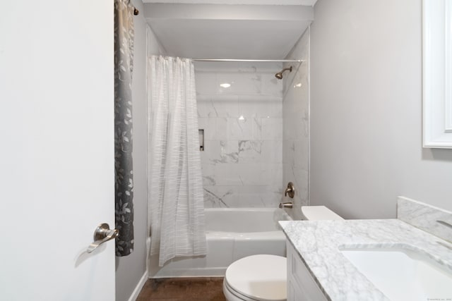 full bathroom featuring vanity, shower / bath combination with curtain, and toilet