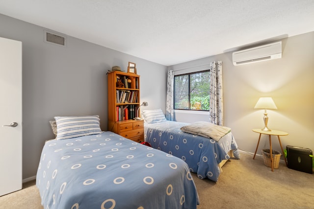 bedroom featuring light carpet and a wall mounted AC