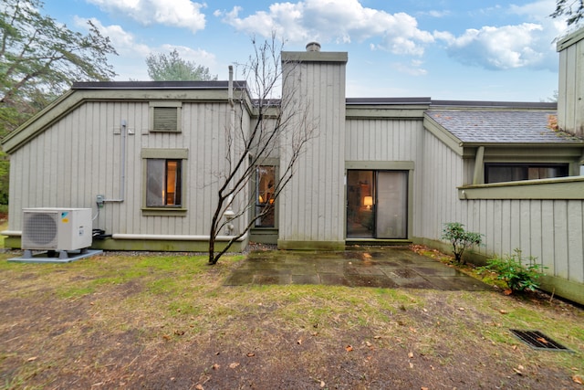 back of house featuring ac unit