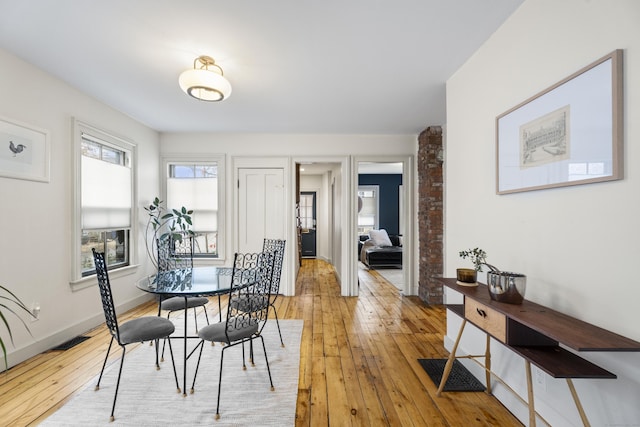 dining space with light wood-type flooring