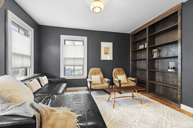 sitting room featuring light hardwood / wood-style floors and a wealth of natural light