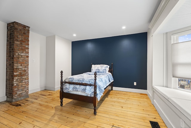 bedroom with light hardwood / wood-style floors