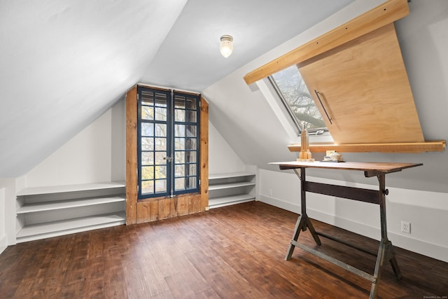 additional living space featuring french doors, hardwood / wood-style floors, and vaulted ceiling