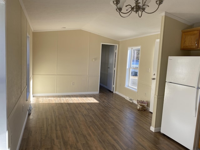 108-16 Clark Rd, Naugatuck, CT 06770 - unfurnished dining area featuring a chandelier, vaulted ceiling, crown molding, dark wood-type flooring, and a decorative wall