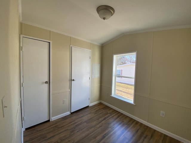 108-16 Clark Rd, Naugatuck, CT 06770 - unfurnished bedroom with dark wood-type flooring, lofted ceiling, crown molding, a decorative wall, and baseboards