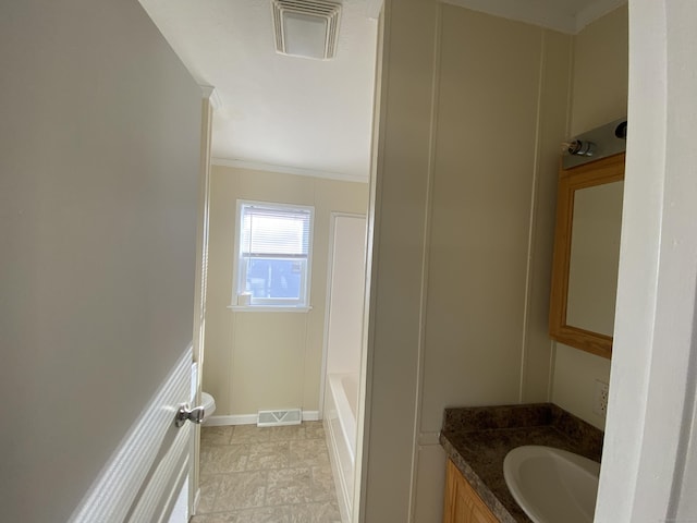108-16 Clark Rd, Naugatuck, CT 06770 - bathroom featuring vanity, a bath, crown molding, and baseboards