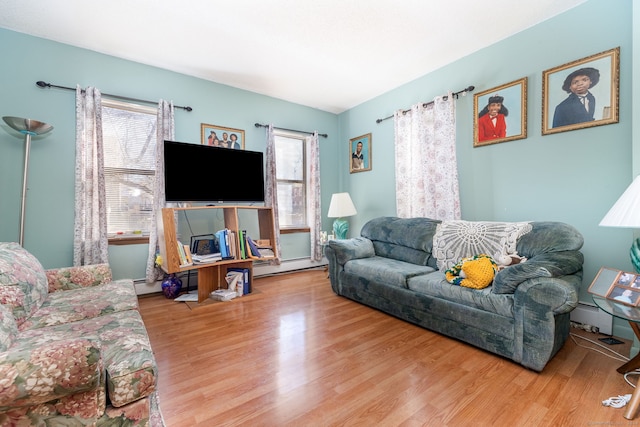 living room featuring wood-type flooring and a baseboard radiator