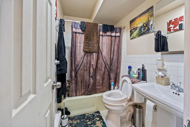 full bathroom featuring sink, tile patterned floors, toilet, shower / tub combo with curtain, and tile walls