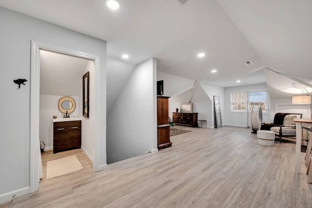 sitting room with light hardwood / wood-style flooring