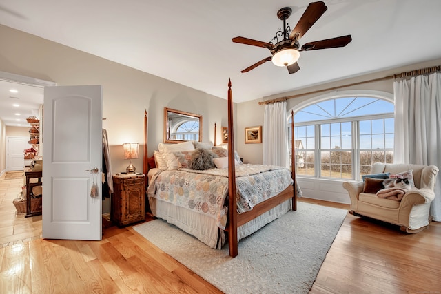 bedroom featuring ceiling fan and light hardwood / wood-style flooring