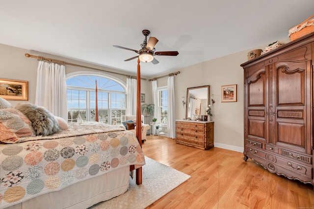 bedroom featuring ceiling fan and light hardwood / wood-style flooring