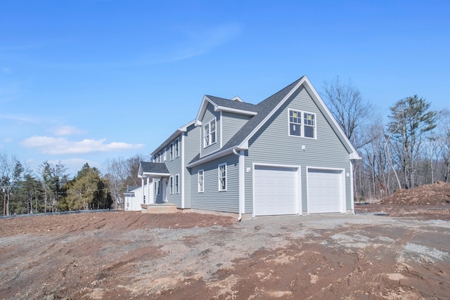 view of home's exterior featuring driveway and an attached garage