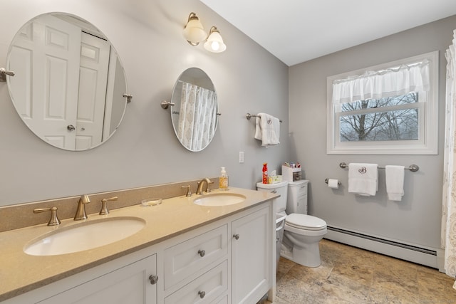 bathroom featuring a baseboard radiator, vanity, and toilet