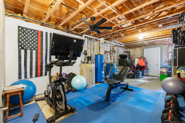 workout room with ceiling fan and gas water heater