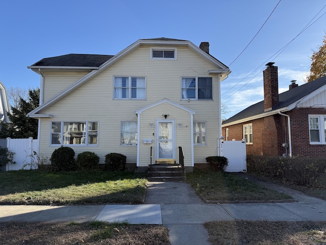 view of front of house with a front lawn