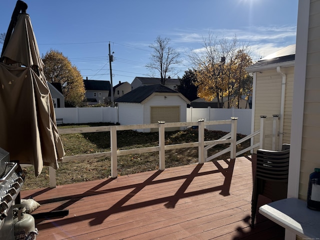 deck with an outbuilding and a garage