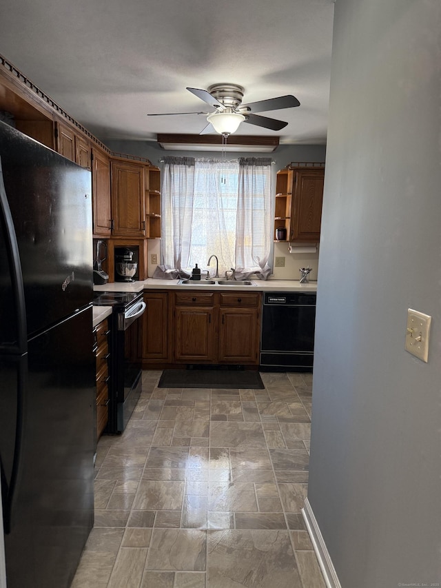 kitchen featuring sink, ceiling fan, and black appliances