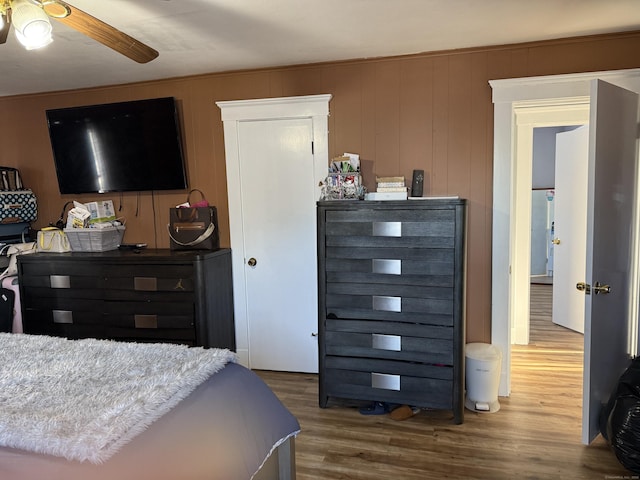 bedroom with hardwood / wood-style flooring