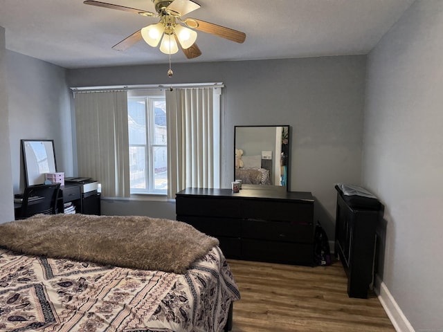 bedroom featuring hardwood / wood-style floors and ceiling fan