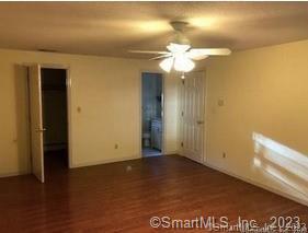 42 Windham Dr, Simsbury, CT 06070 - empty room featuring a ceiling fan and wood finished floors