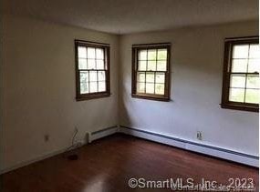 empty room with a baseboard heating unit