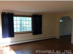 42 Windham Dr, Simsbury, CT 06070 - unfurnished room featuring dark wood-style floors