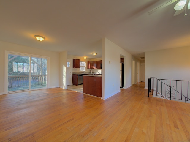 unfurnished living room with light hardwood / wood-style floors and ceiling fan