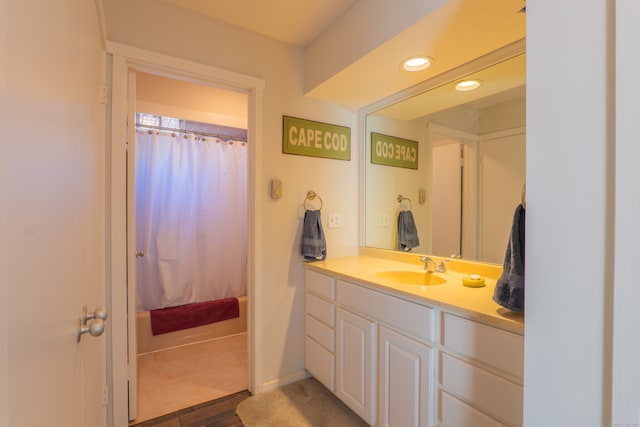 bathroom featuring wood-type flooring, vanity, and walk in shower