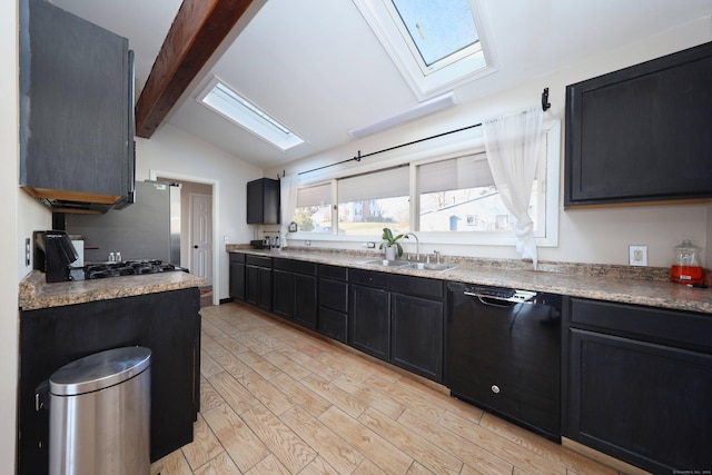 kitchen featuring stainless steel range, lofted ceiling with skylight, sink, light hardwood / wood-style flooring, and dishwasher