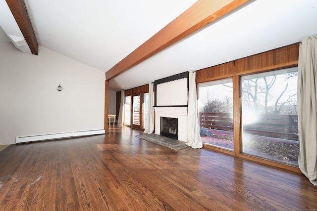 unfurnished living room featuring lofted ceiling with beams, dark hardwood / wood-style floors, baseboard heating, and a healthy amount of sunlight