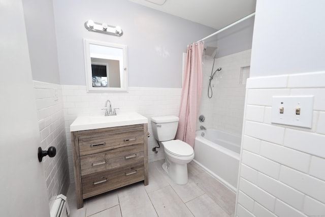 full bathroom with shower / tub combo, a baseboard radiator, toilet, vanity, and tile walls