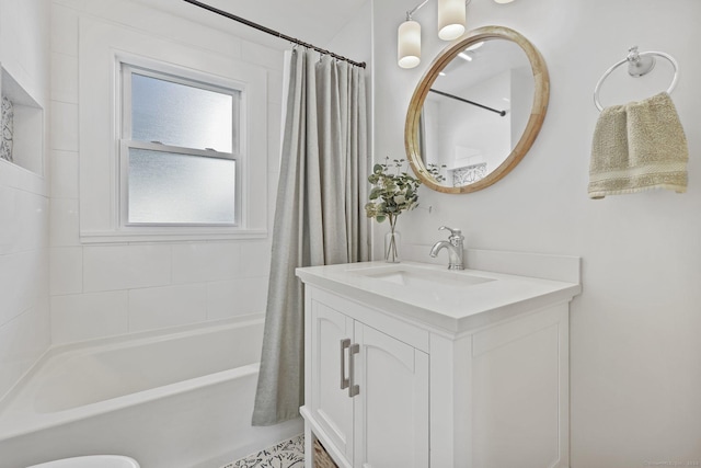 bathroom with shower / tub combo and vanity