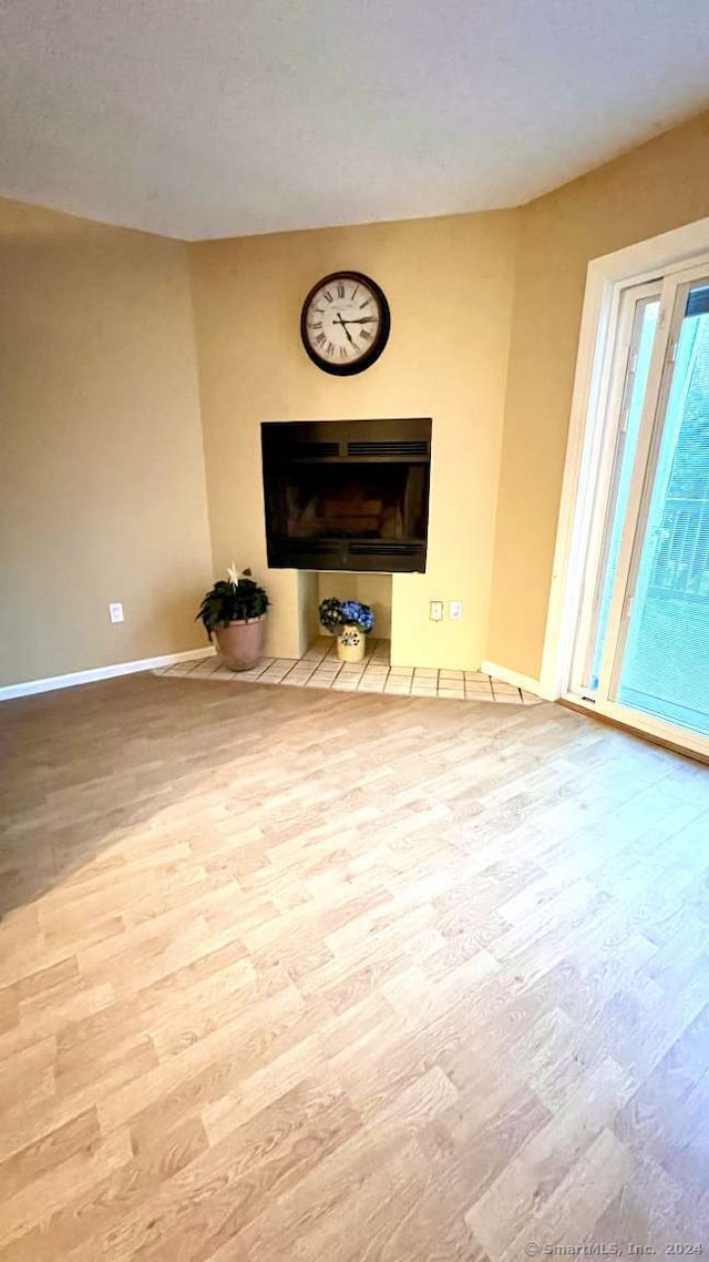 unfurnished living room featuring light hardwood / wood-style flooring