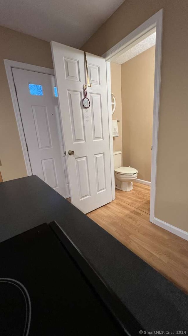 foyer entrance with hardwood / wood-style floors