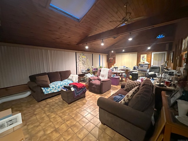 tiled living room featuring ceiling fan, lofted ceiling with skylight, and wooden ceiling