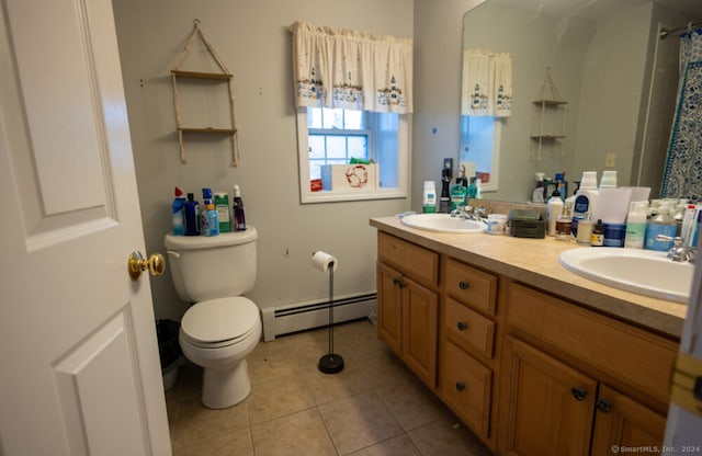 bathroom with baseboard heating, tile patterned floors, vanity, and toilet