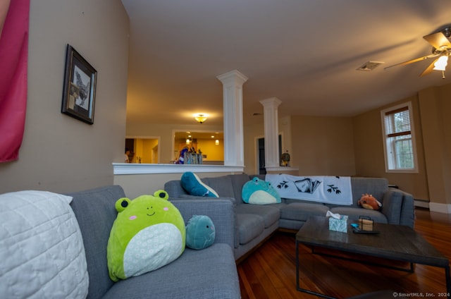 living room featuring ceiling fan, wood-type flooring, and baseboard heating