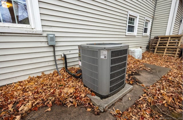 exterior details featuring fence and central AC