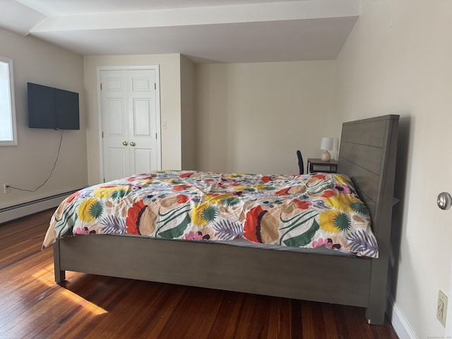 bedroom featuring dark wood-type flooring and baseboards