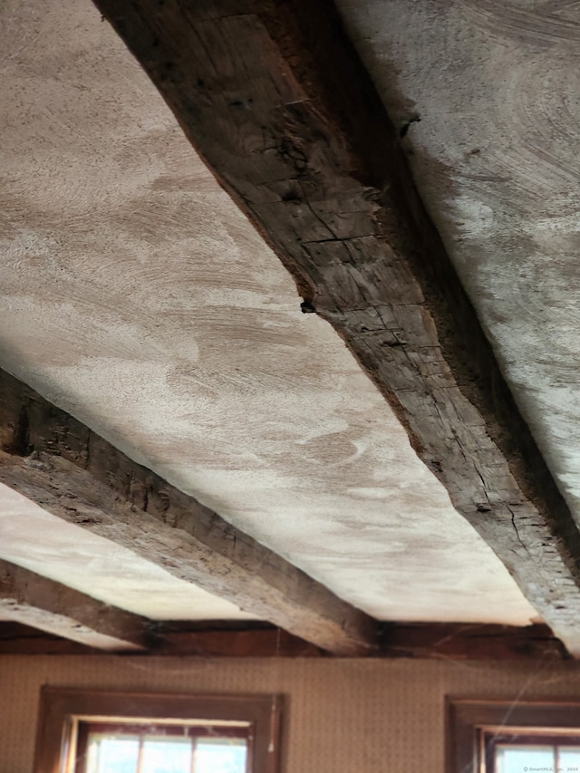 interior details featuring beam ceiling