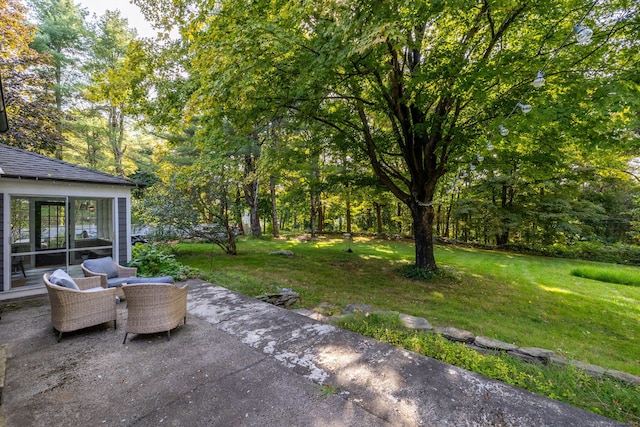 view of patio / terrace featuring a sunroom