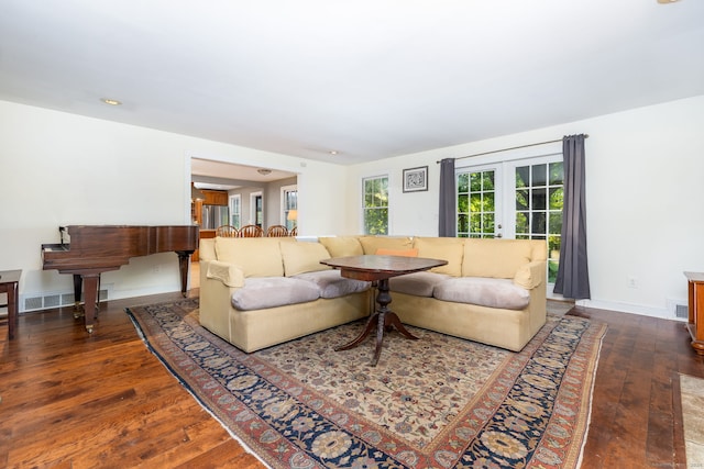living area featuring recessed lighting, visible vents, french doors, baseboards, and hardwood / wood-style flooring