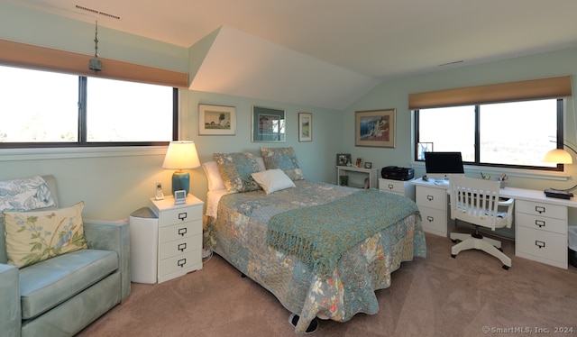 carpeted bedroom featuring vaulted ceiling